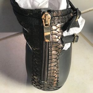 Black faux leather flat with ankle strap